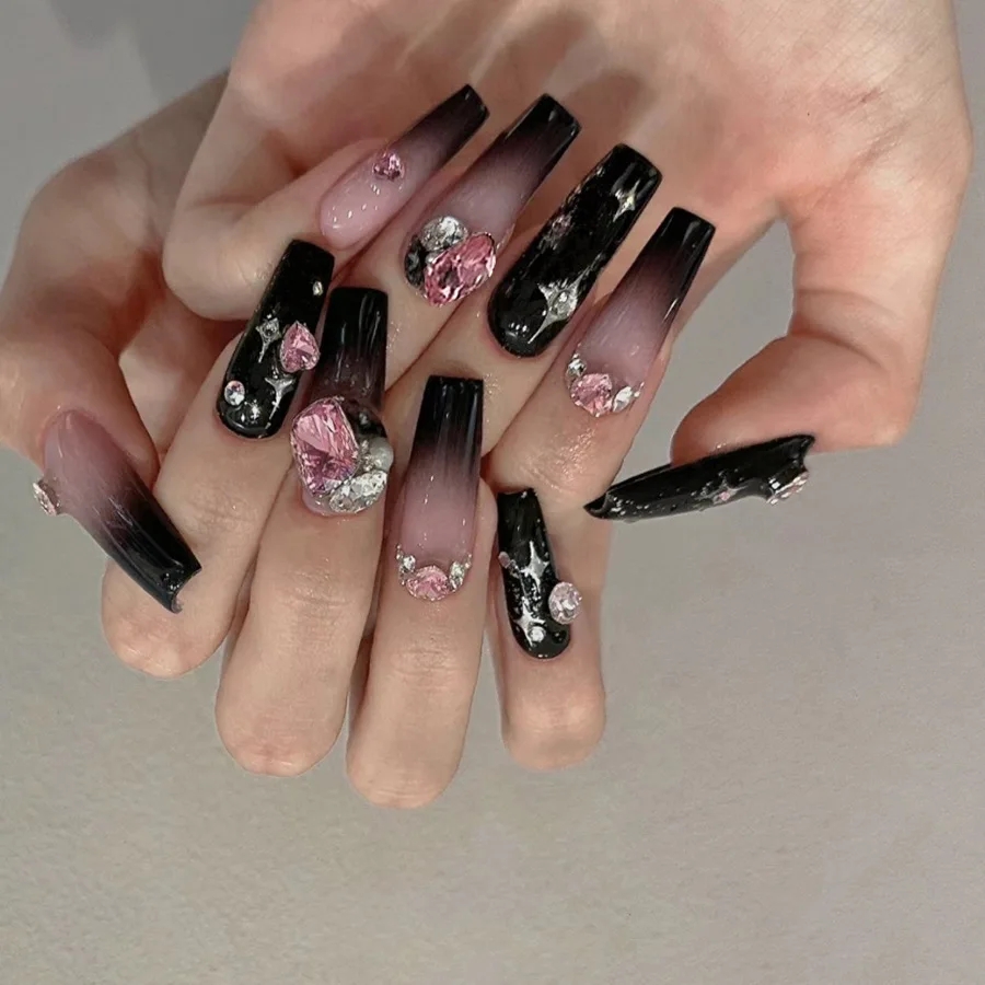 black nails with pink designs